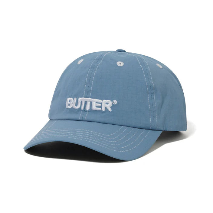 BUTTER GOODS NYLON ROUNDED LOGO 6 PANEL CAP